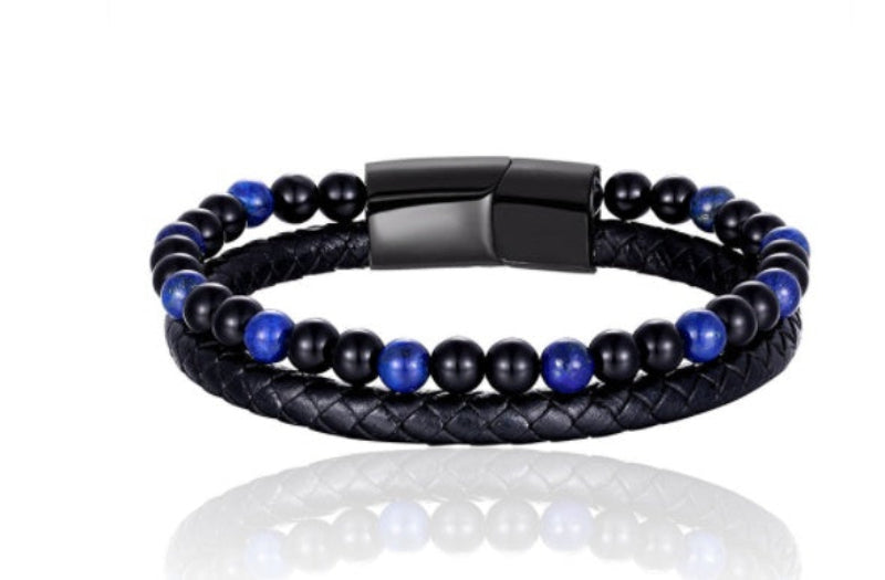 Black and blue beaded bracelet with leather wrap on a white background