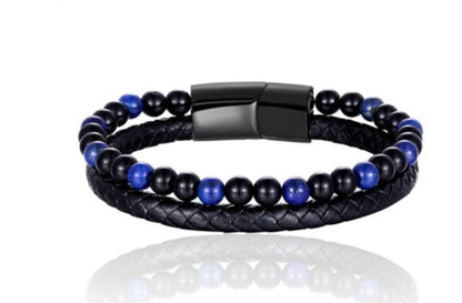 Black and blue beaded bracelet with leather wrap on a white background