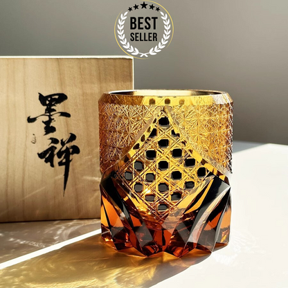 An amber-colored hand-cut crystal whisky glass with a geometric pattern, displayed alongside its packaging box with Japanese characters. A 'Best Seller' badge is also visible in the top right corner.