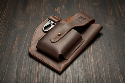 Brown leather pouch with a buckle on a wooden surface, featuring the Bullcaptain brand.