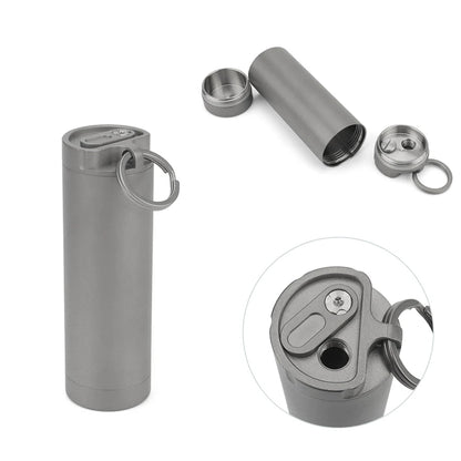 Gray metal container with keychain and multiple components on a white background, featuring the brand 'Advance'.