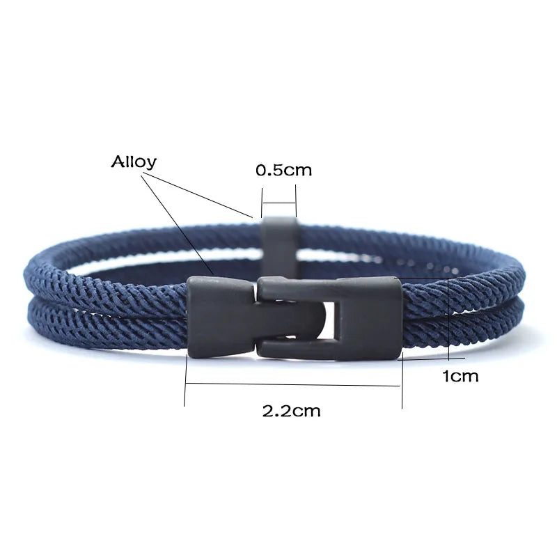 Navy blue braided bracelet with a black clasp, showing measurements on a white background.