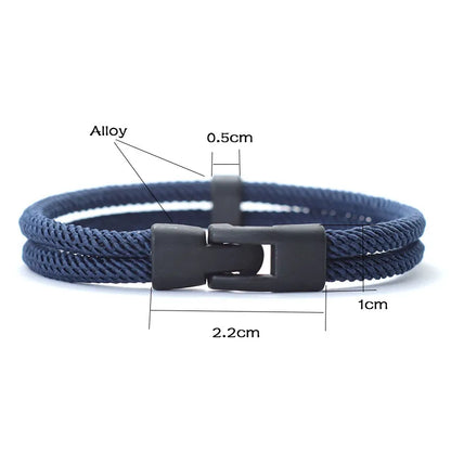 Navy blue braided bracelet with a black clasp, showing measurements on a white background.