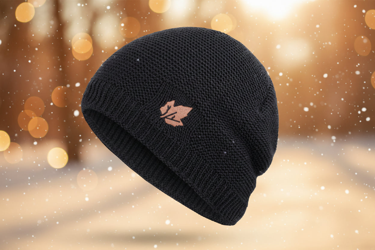 Black knit beanie with a rose gold logo on a white background
