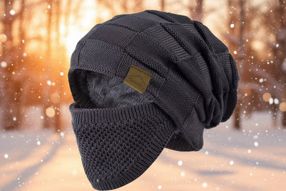 Knitted beanie with a fur-lined hood on a white background