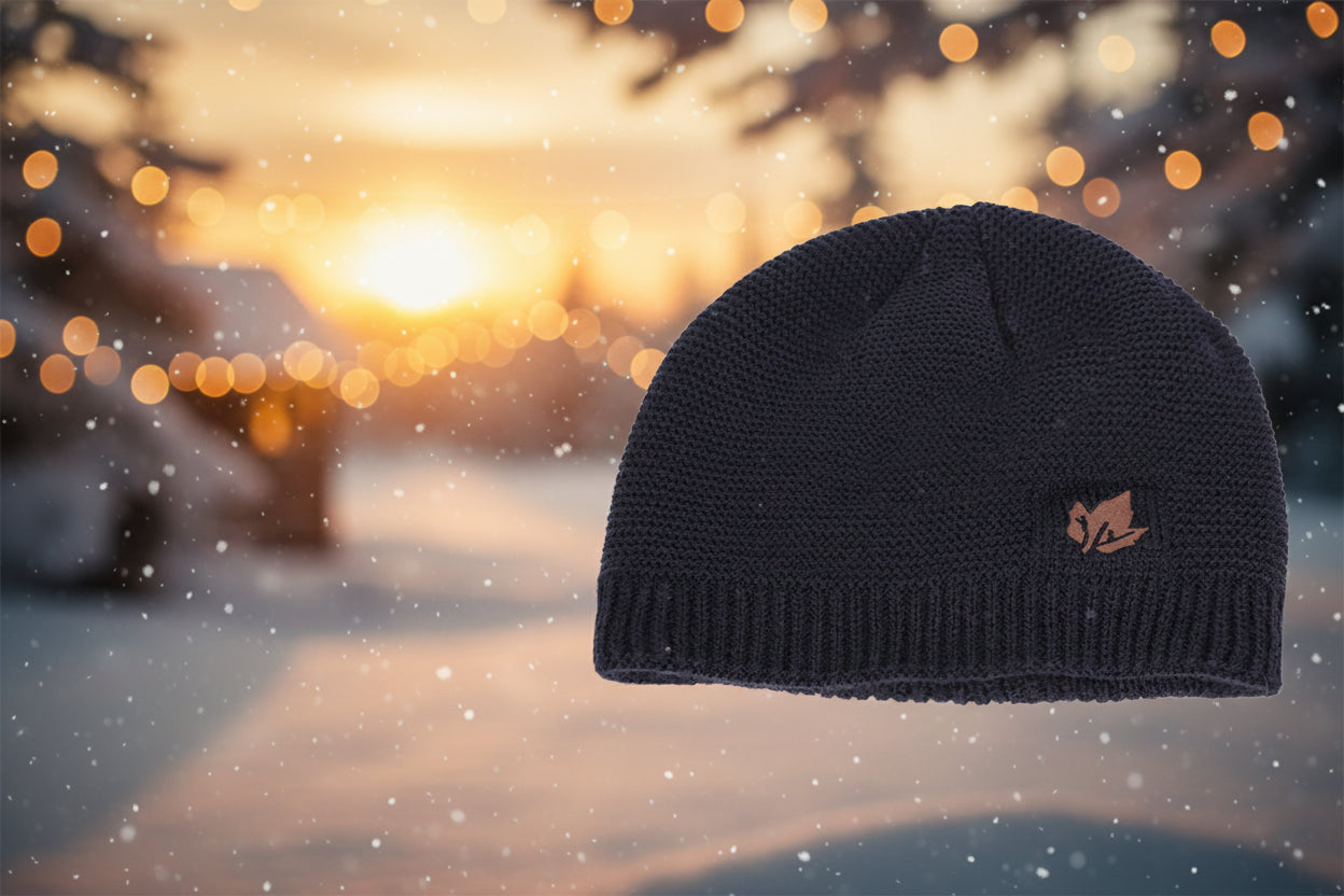 Black knit beanie with a logo on a white background