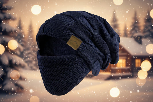 Navy blue knit beanie with a brand label on a white background