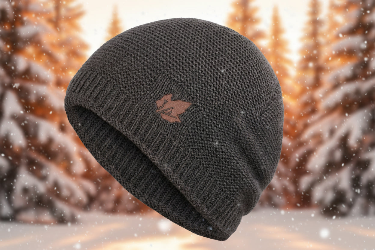 Dark gray knit beanie with a logo on a white background.