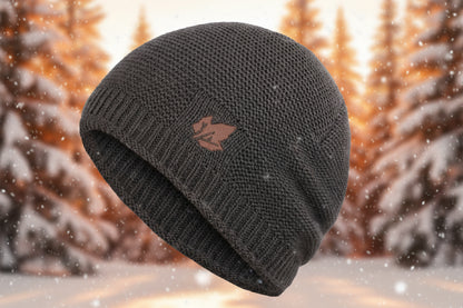 Dark gray knit beanie with a logo on a white background.