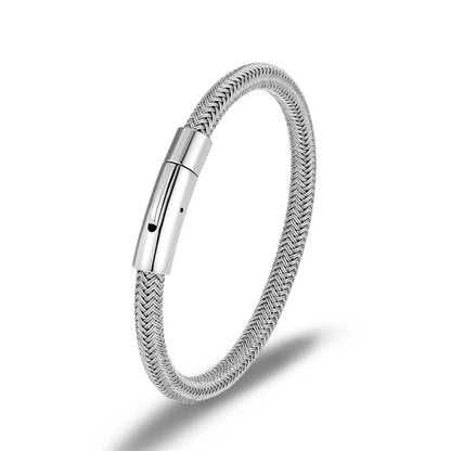 Silver bracelet with a textured band on a white background