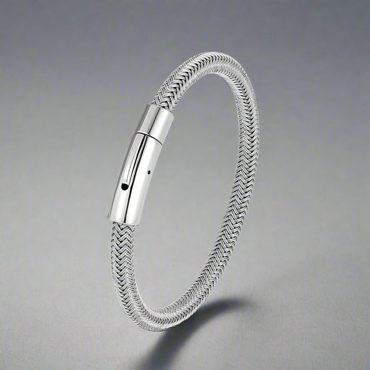 Silver braided bracelet with a metallic clasp on a white background