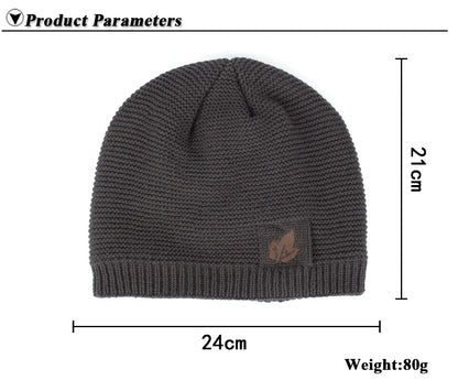 Gray knit beanie with a small logo on a white background, showing measurements and weight.