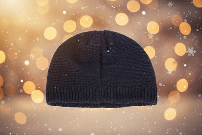 Dark blue knit beanie on a white background