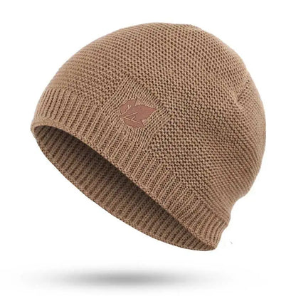 Brown knit beanie with a logo on a white background